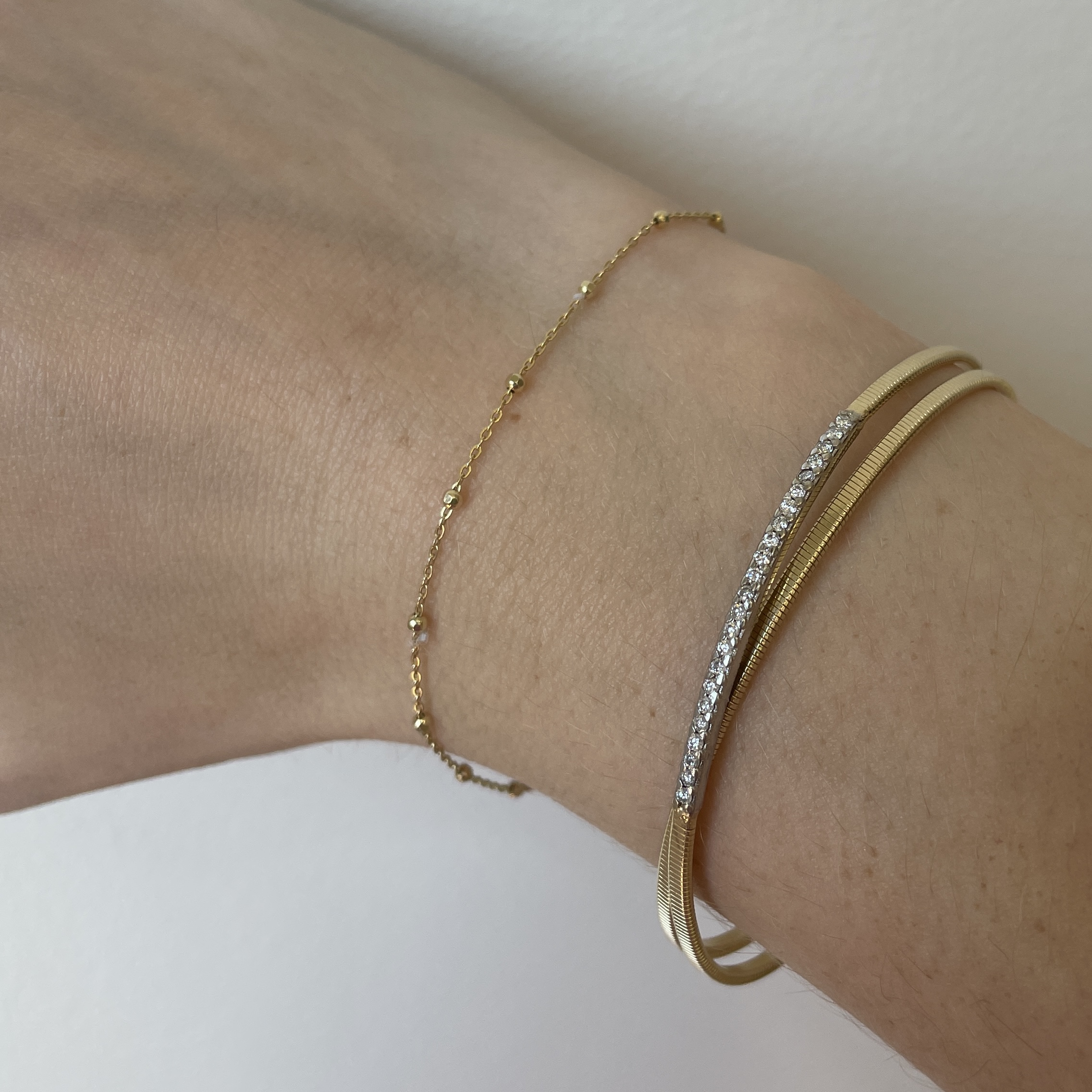 Estate: Yellow Gold Criss Cross Diamond Flex Bangle