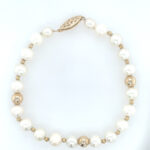 Estate: Yellow Gold Bead and Freshwater Pearl Row Bracelet